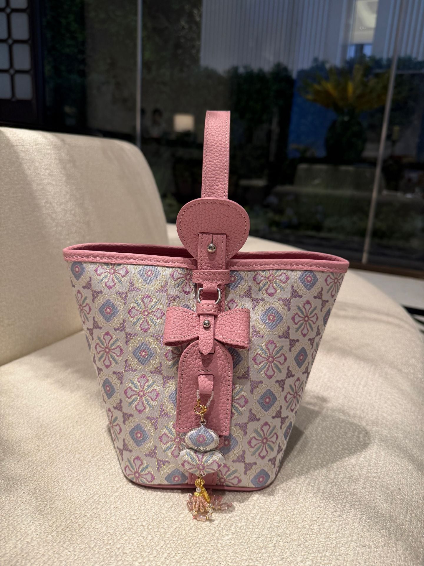 Close view of Song brocade bucket bag showing woven motif texture and refined image row 446