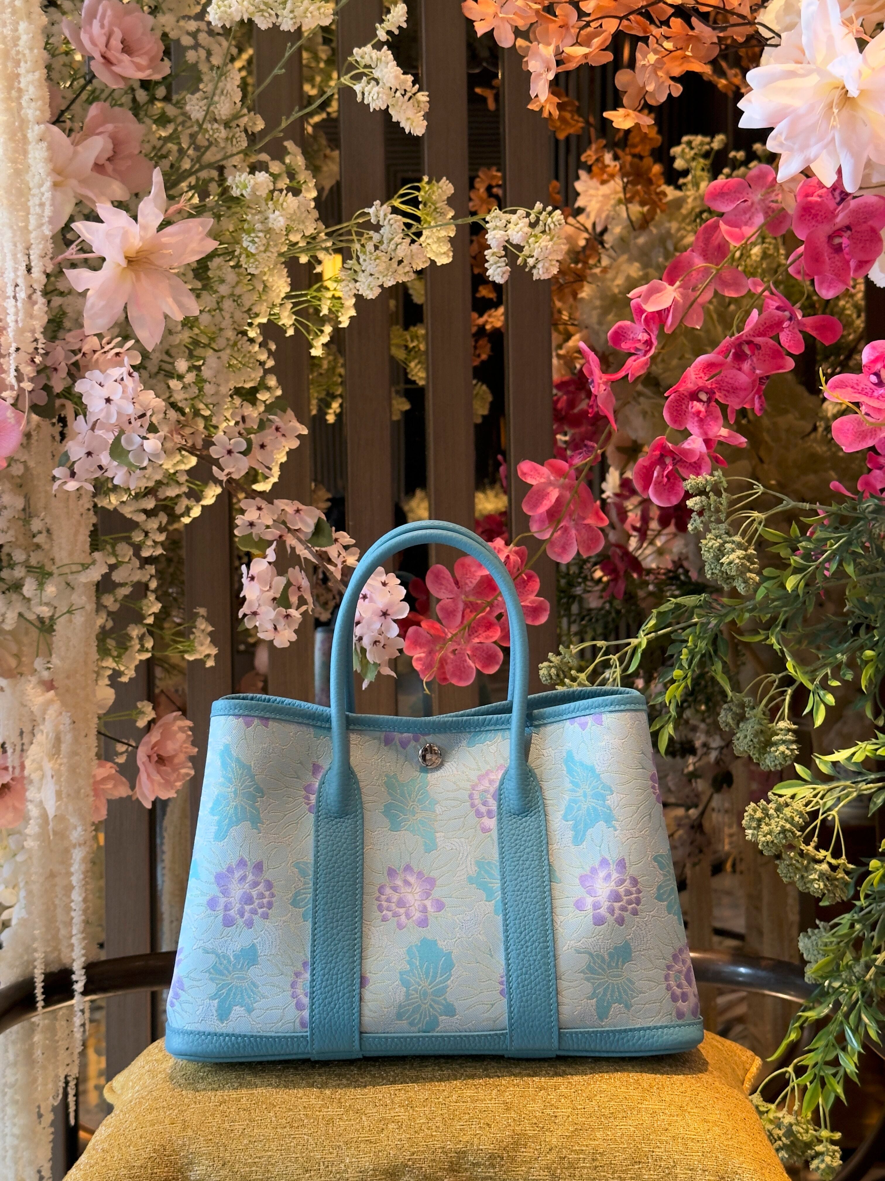 Close view of mulberry silk clutch bag showing woven motif texture and refined finish for Song Brocade Garden Tote styling