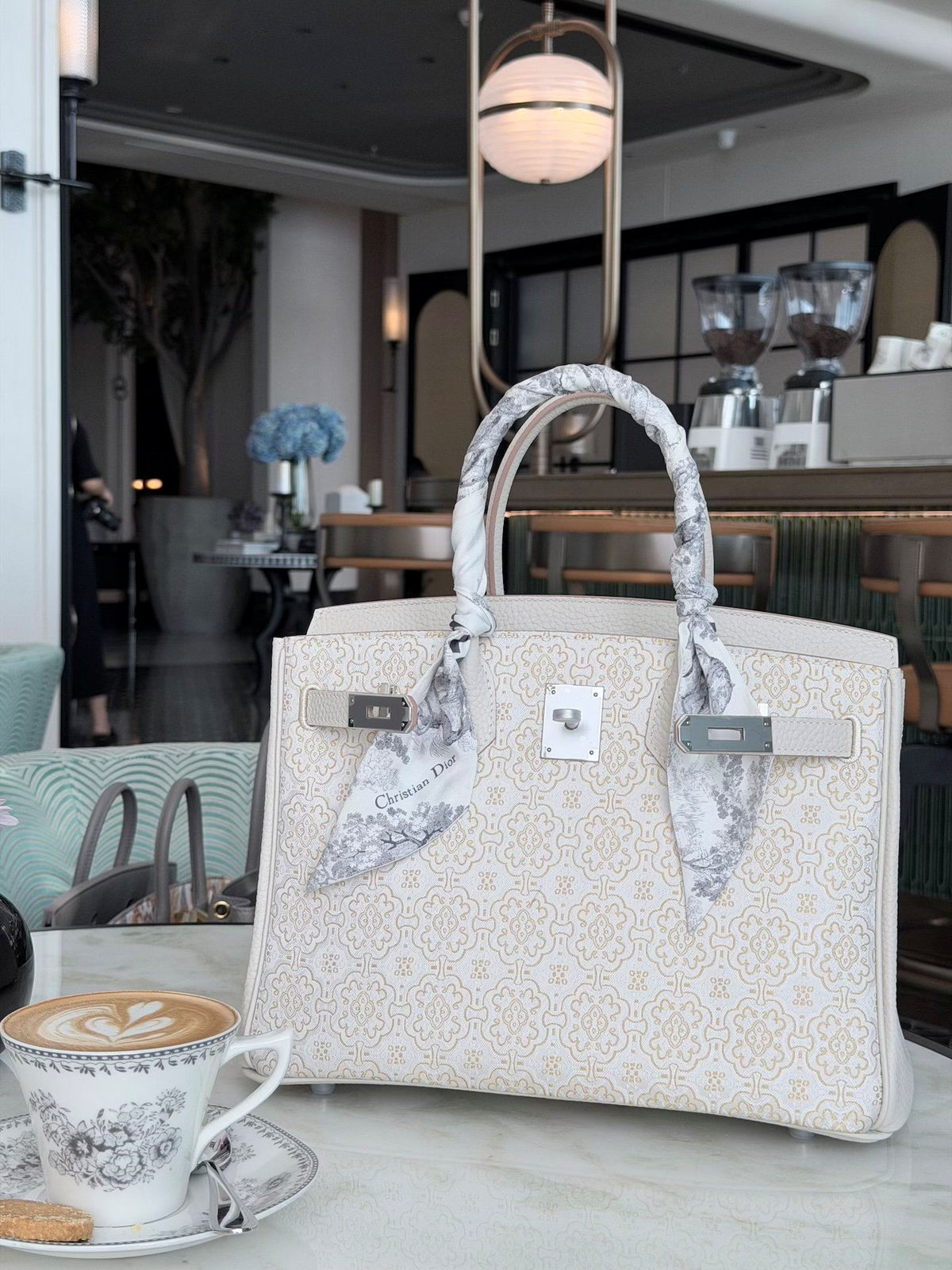 Song brocade Kelly bag with Dingsheng motif and structured elegant handbag silhouette