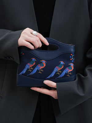 Clutch bag detail with refined hardware, secure closure, and heritage textile craftsmanship for Song Brocade Mulberry Silk