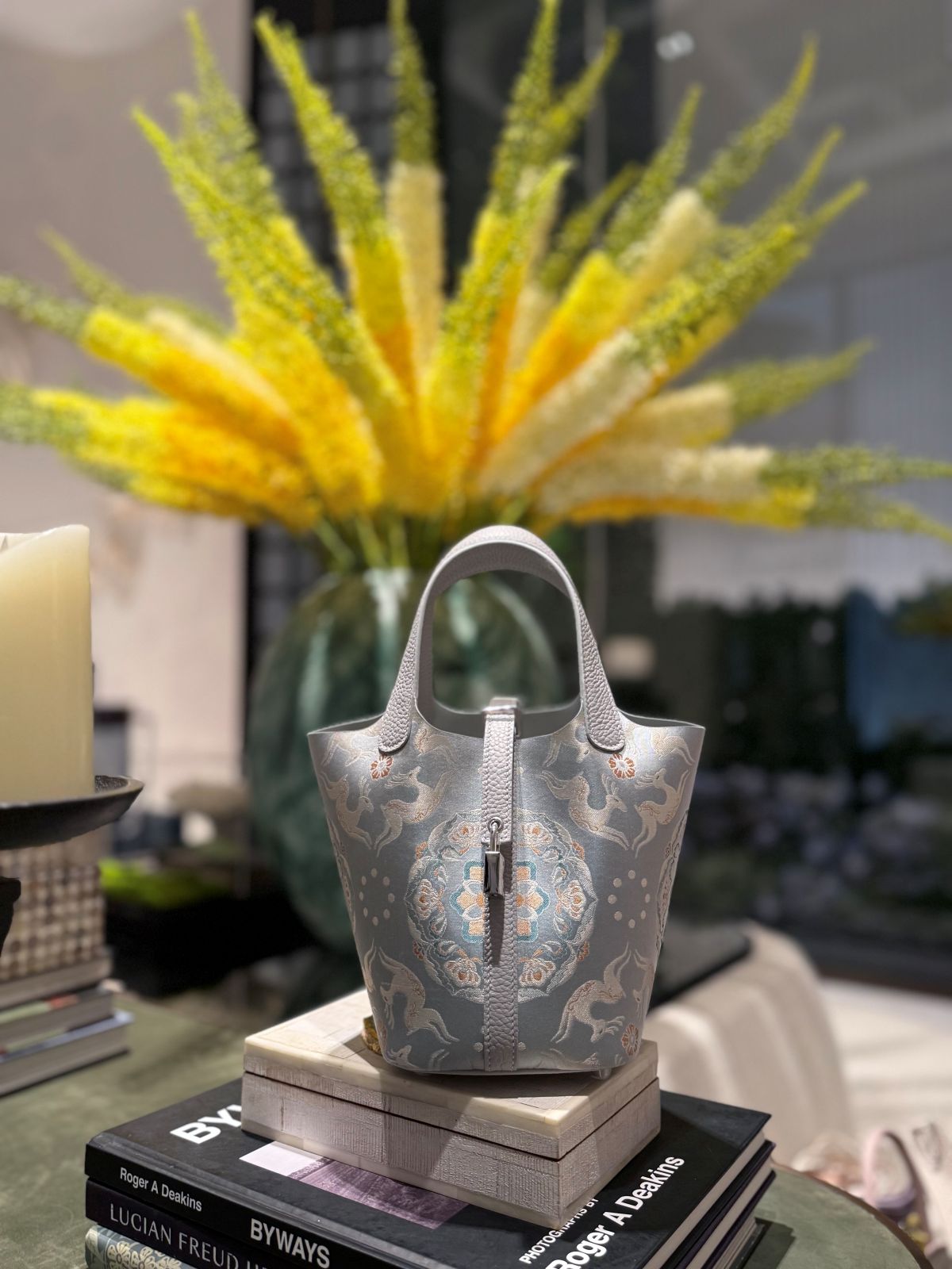 Mulberry silk bucket bag three-quarter view with heritage-inspired motif and refined handbag finish featuring Handmade Top