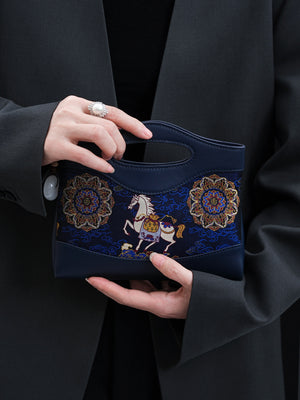 Clutch bag view showing compact structure, carry options, and daily essentials capacity featuring Song Brocade Mulberry Silk