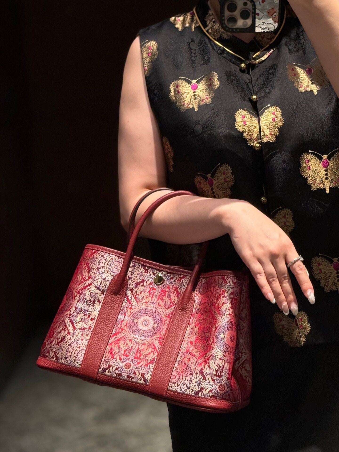 Close view of mulberry silk clutch bag showing woven motif texture and refined image row 502