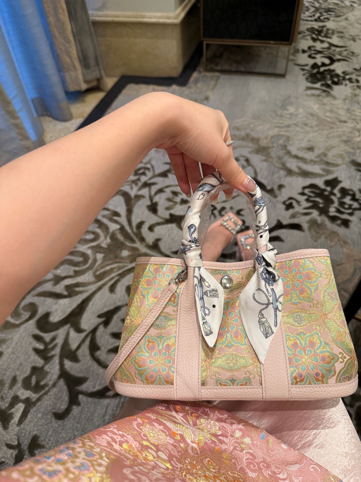 Close view of mulberry silk clutch bag showing woven motif texture and refined image row 497