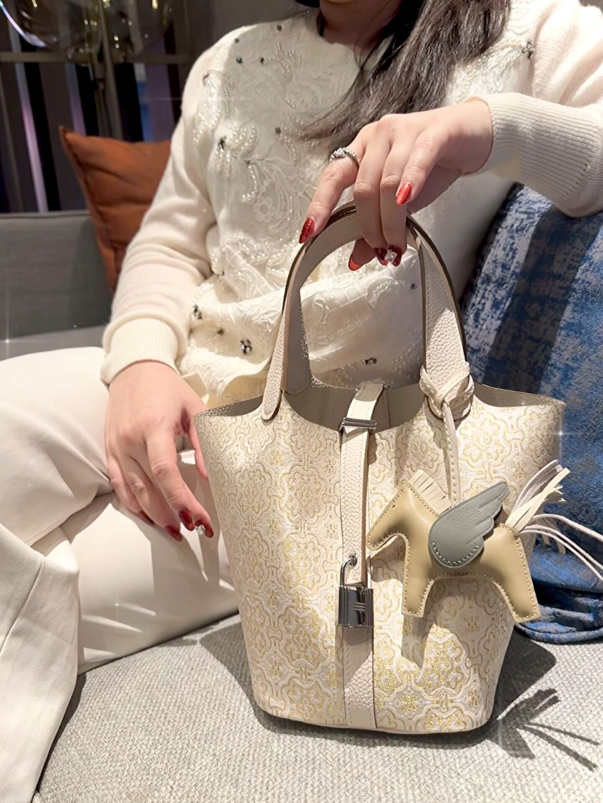 Mulberry silk bucket bag detail view with Dingsheng motif and refined handbag finish
