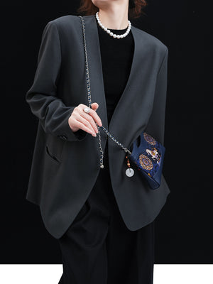 Mulberry silk clutch bag side view with lucky horse motif and refined handbag finish