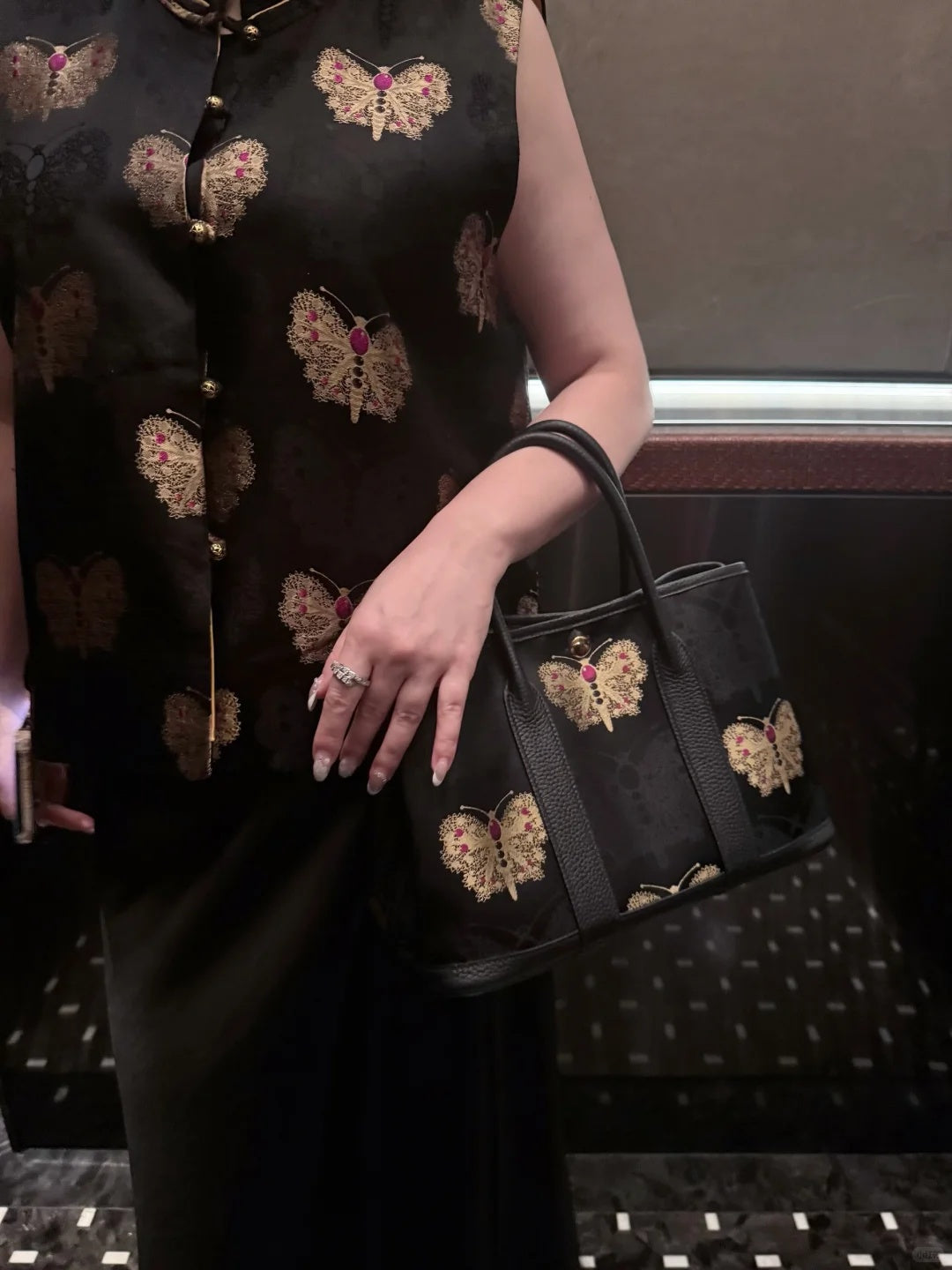 Close view of mulberry silk clutch bag showing woven motif texture and refined image row 488