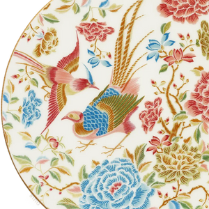 Close-up of gold rim and floral bird pattern on Chinoiserie bone china plate.