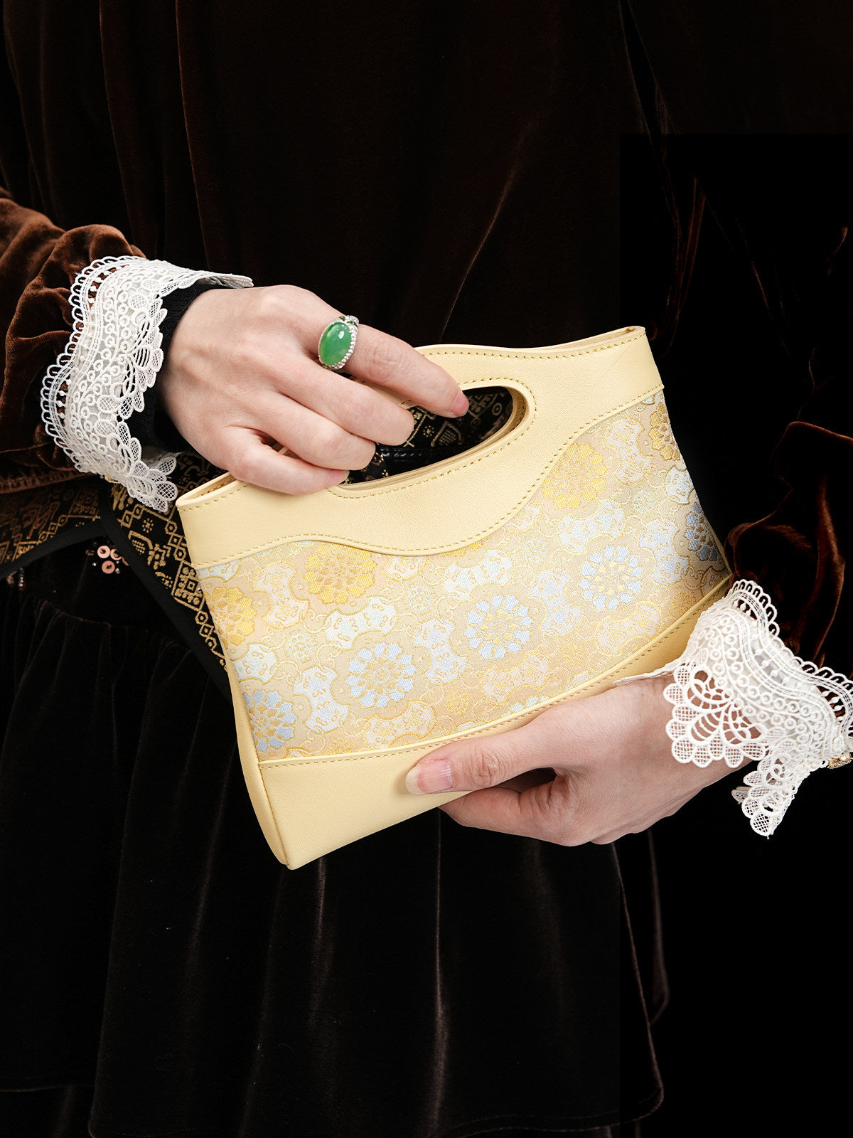Close view of mulberry silk clutch bag showing woven motif texture and refined finish image 2