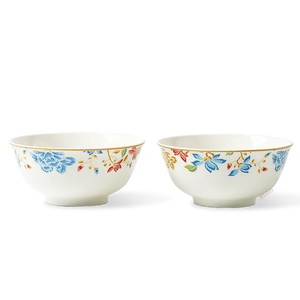 Two Chinoiserie bone china round bowls in symmetric front view with floral design.