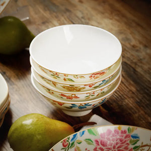 Four Chinoiserie footed bowls stacked together.