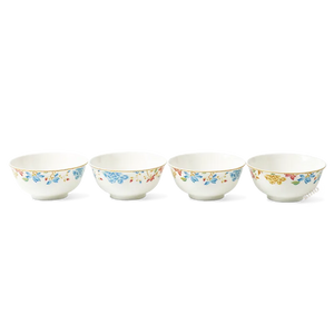 Four floral porcelain bowls aligned in a row showing consistent sizing.