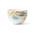 Four stacked floral chinoiserie bone china round bowls on white background.