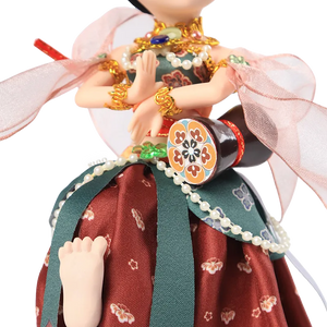9-inch Dunhuang "Drumming Grace" doll's body and lifted foot showing dynamic pose.