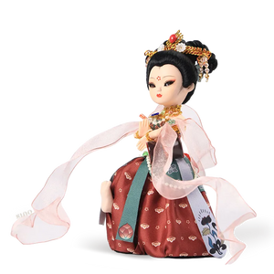 Left side view of 9-inch Dunhuang "Drumming Grace" doll showing silk skirt and floating ribbons.