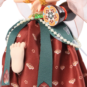 Lower body of 9-inch Dunhuang doll with bare foot and lifted pose.