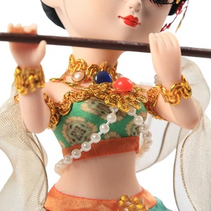 Body outfit detail of 9-inch Dunhuang "Flute Song" doll with green and orange layers.