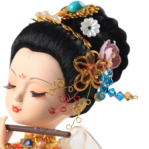 Left head detail of 9-inch Dunhuang "Flute Song" doll with hair and flowers.