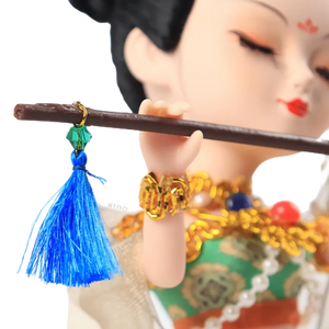 Right face, neck decor, and flute detail of 9-inch Dunhuang "Flute Song" doll.