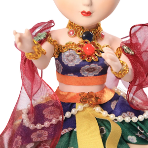 Body outfit detail of 9-inch Dunhuang "Harp Melody" doll with green/red layers and floral patterns.