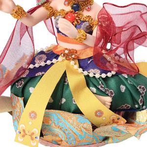 Skirt detail of 9-inch Dunhuang "Harp Melody" doll with intricate blue/gold embroidery.