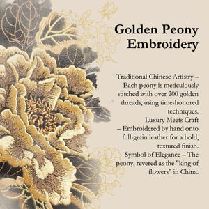 Golden peony embroidery detail on black leather luxury handbag.