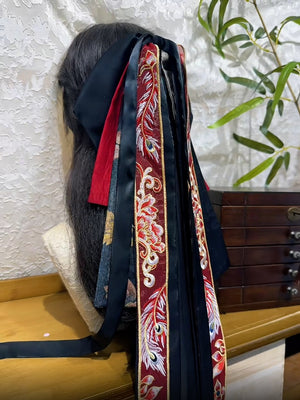 Feng Qiu Huang statement hair accessory showing embroidery, tassel details and long ribbon tails