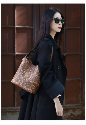 Chinese embroidered bucket bag styled for modern Chinese outfits and elegant daily carry featuring Dunhuang Scroll Grass