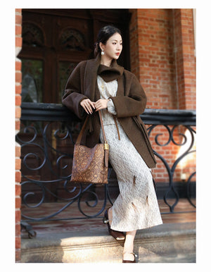 Chinese embroidered bucket bag back view with heritage-inspired motif and refined handbag finish