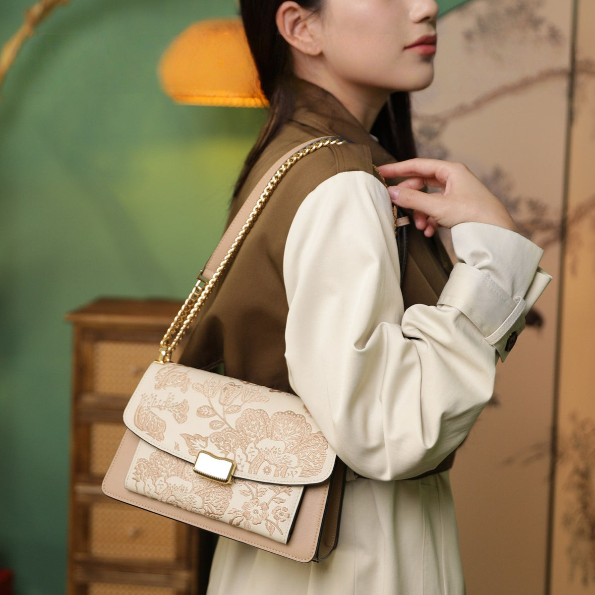 Close view of embroidered crossbody bag showing floral texture and refined leather finish featuring Chinese Style Begonia