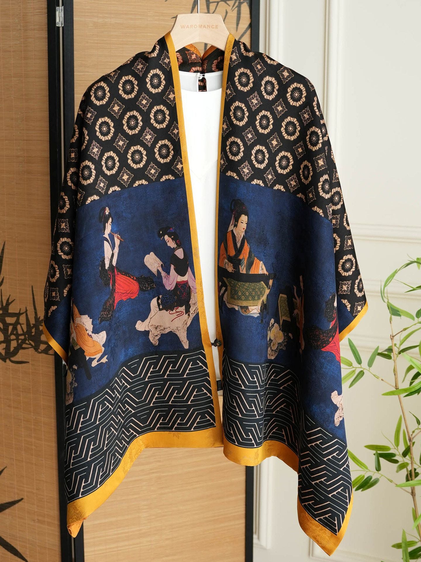Close view of Xiangyunsha silk scarf showing smooth silk texture, color detail, and refined drape