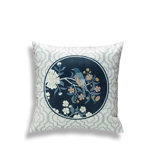Blue embroidered pillow with circular birds and flowers.