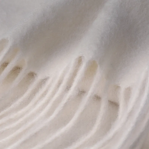 Delicate hand-knotted fringe on cashmere scarf.