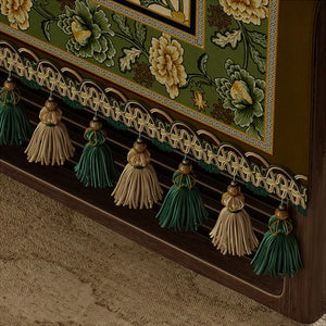 Hand-tied fringe detail on tablecloth edge.