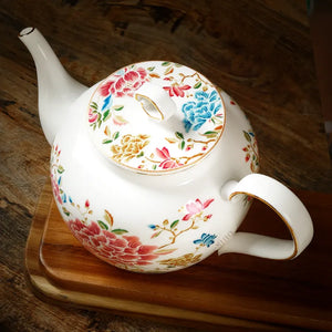 Top view of 420ml chinoiserie teapot on table showing lid detail, floral design.