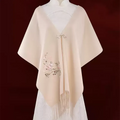 Handcrafted plum blossom embroidery on luxury cashmere scarf in gift box.