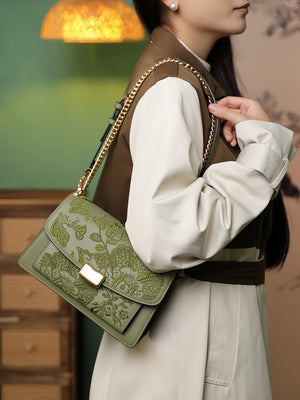 Close view of embroidered crossbody bag showing floral texture and refined leather finish featuring Chinese Style Begonia-brocademodern