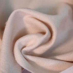 Silky-soft cashmere scarf draping elegantly, demonstrating flexibility.