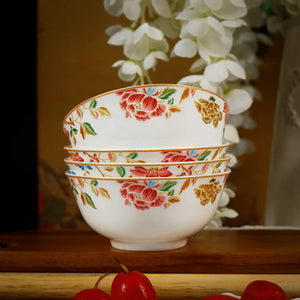 Front view of stacked floral bone china bowls on display shelf.