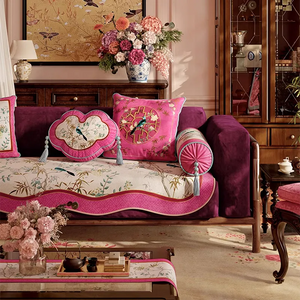 Ruyi and armrest chinoiserie window lattice pillows on sofa left side.