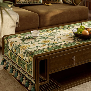 Close-up of golden peony and songbird pattern.