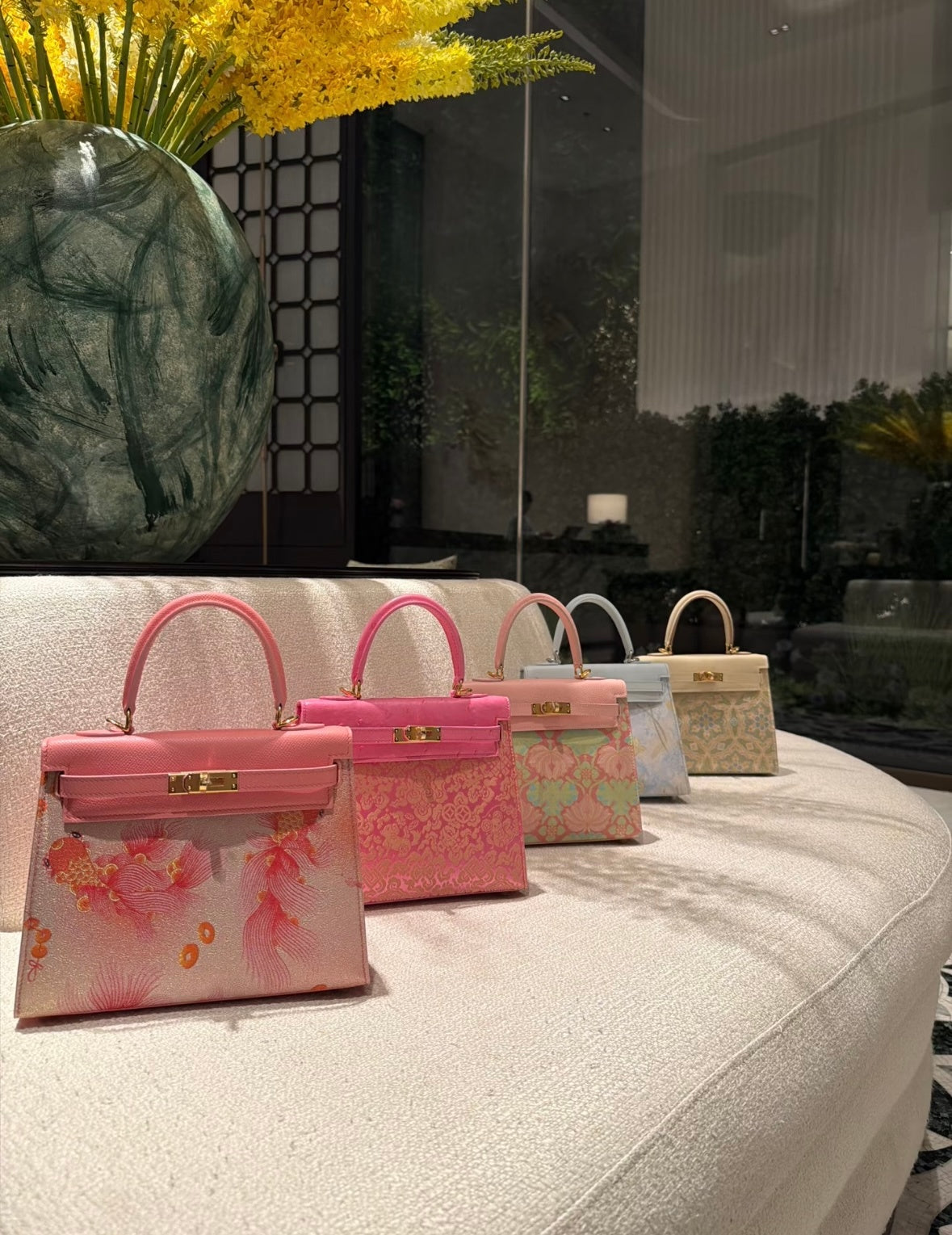 Five small Song brocade structured top-handle bags in pink, blue and cream