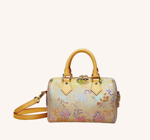 Boston bag detail with refined hardware, secure closure, and heritage textile craftsmanship