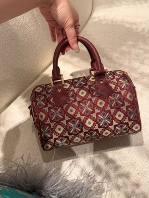 Boston bag detail with refined hardware, secure closure, and heritage textile craftsmanship gift angle