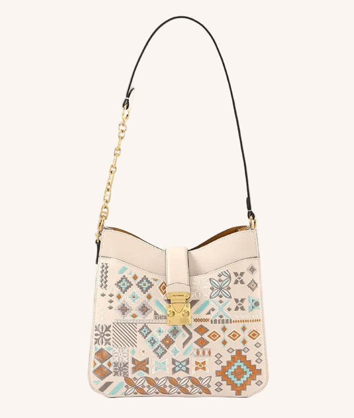 Close view of embroidered shoulder bag showing floral texture and refined leather finish featuring Elegant Chinese Style
