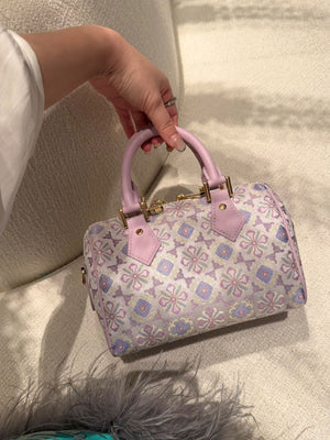 Boston bag detail with refined hardware, secure closure, and heritage textile craftsmanship front angle