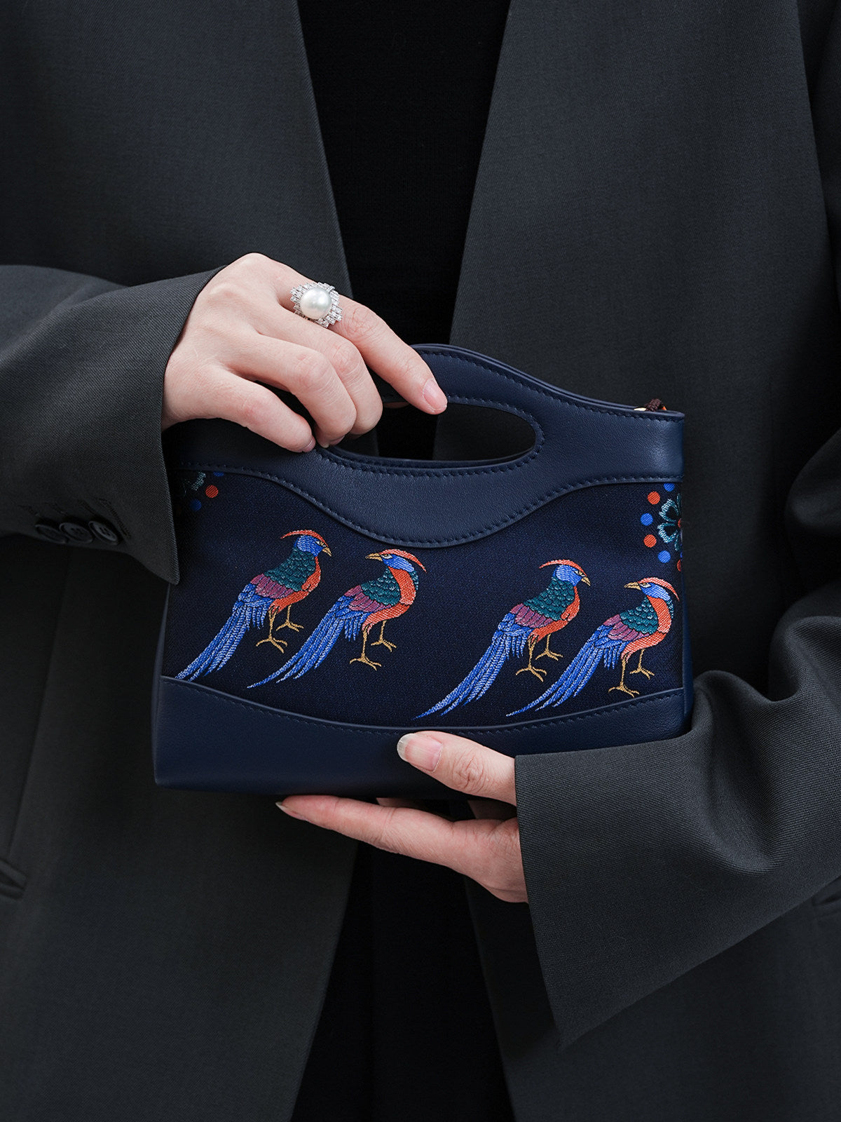 Clutch bag detail with refined hardware, secure closure, and heritage textile craftsmanship for Song Brocade Mulberry Silk