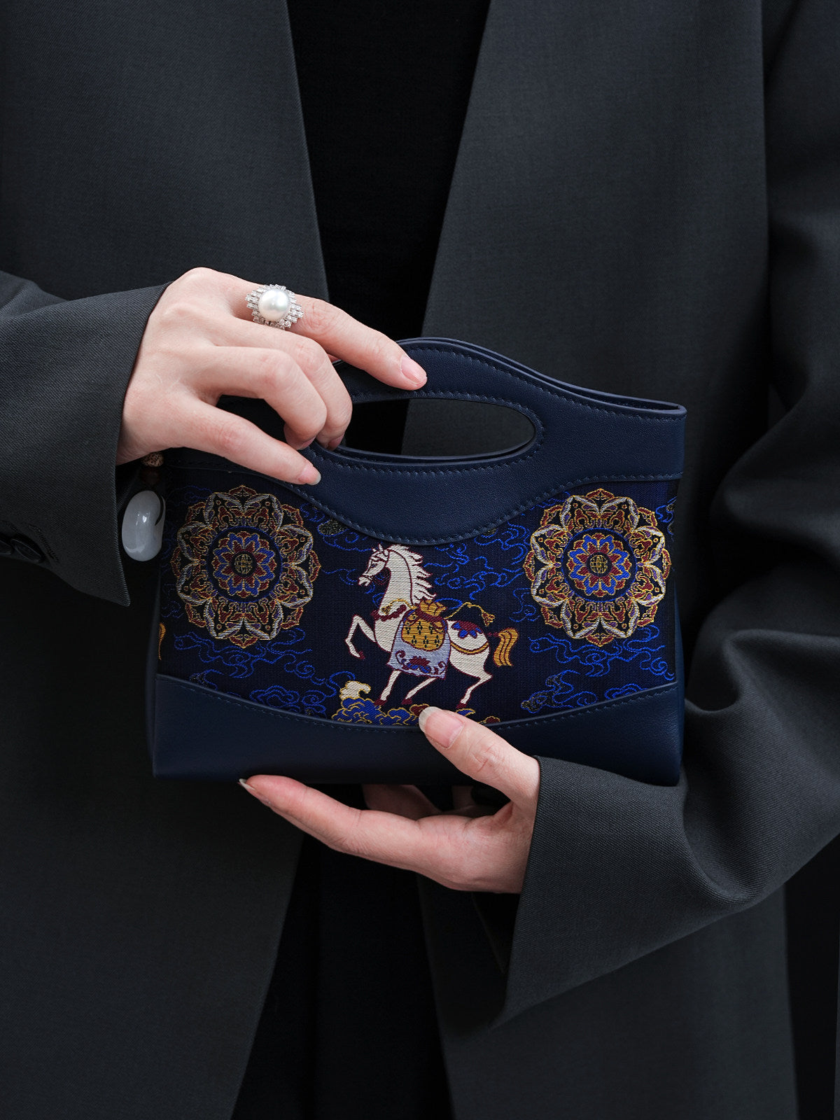 Clutch bag view showing compact structure, carry options, and daily essentials capacity featuring Song Brocade Mulberry Silk