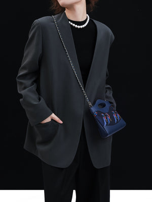 Mulberry silk clutch bag back view with lucky horse motif and refined handbag finish