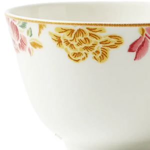 Floral rim detail of Chinoiserie bone china tea cup.